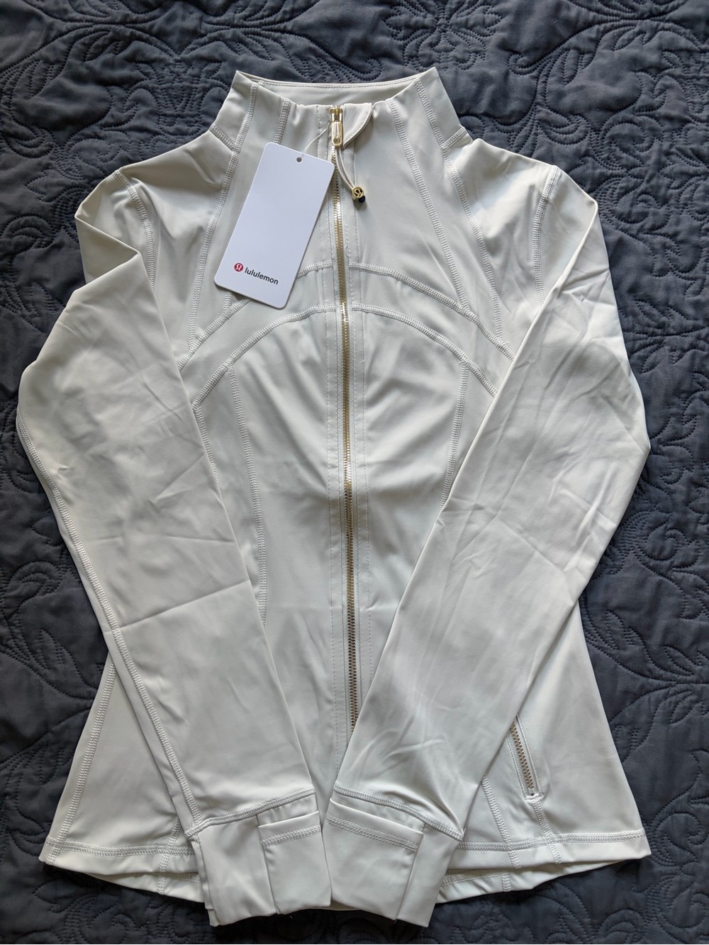 White cream lululemon define jacket with gold zipper.   I ship same day or next